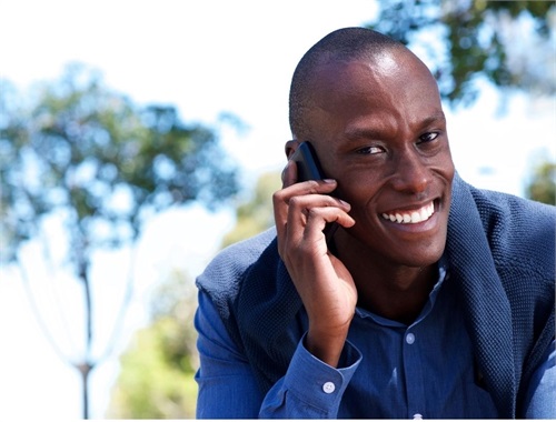 a man talking on a cell phone